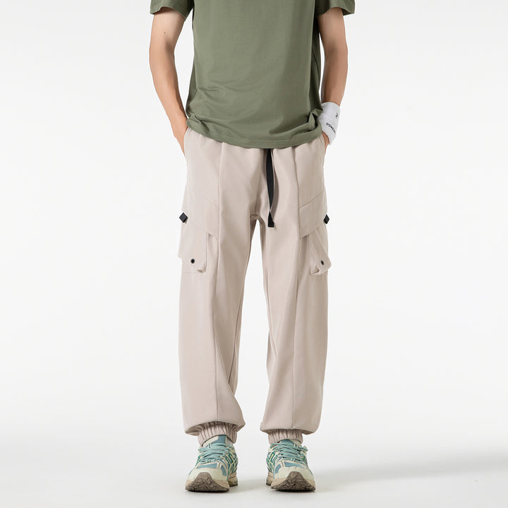 Men's loose cargo jogger pants with elastic drawstring waistband, multiple flap pockets, and ribbed ankles Drune