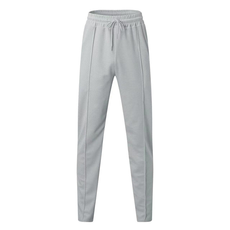 Men's patterned jogging pants with elastic drawstring, shaping crease, and tapered leg Mune Fashion