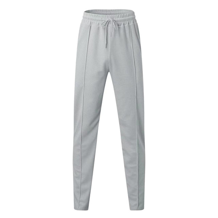 Men's patterned jogging pants with elastic drawstring, shaping crease, and tapered leg Mune Fashion