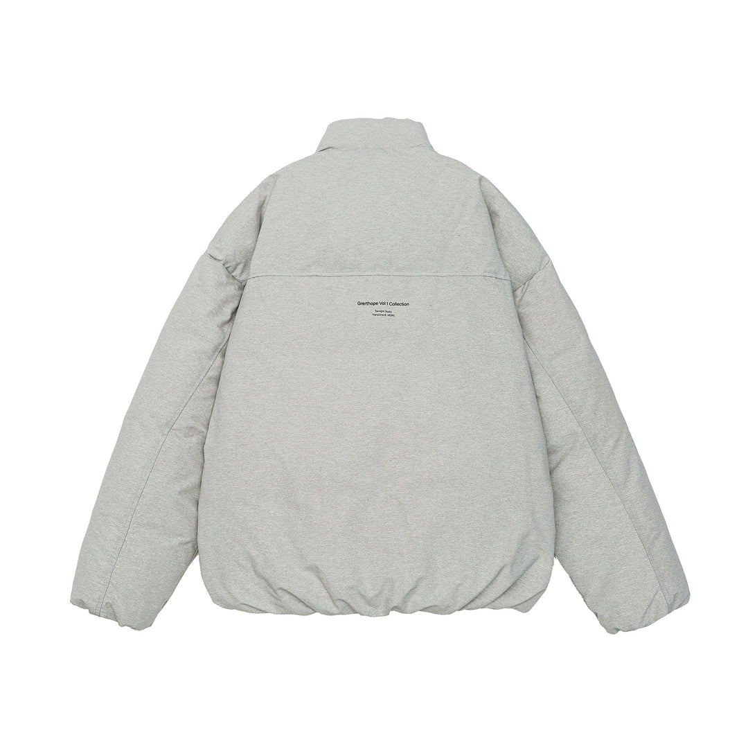 Women short cut oversized quilted jacket with high stand-up collar and concealed zipper Mune Fashion