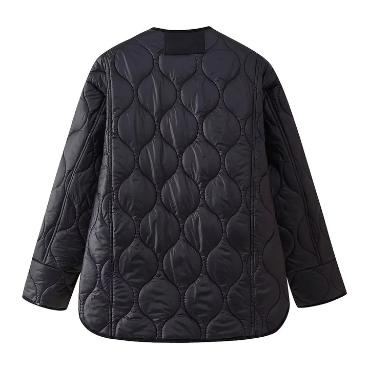 Women's light quilted transitional jacket with organic wave quilting, round neck, dropped shoulders, and flap pockets Mune Fashion
