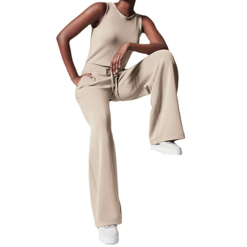 Women's sleeveless knitted jumpsuit with wide palazzo legs, drawstring waistband, and patch pockets Mune Fashion