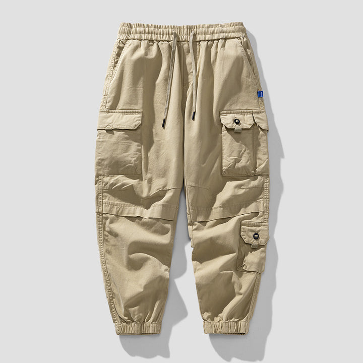 Herren Leichte Canvas-Cargohose im Joggerstil mit elastischem Bund, segmentierten Kniepaneelen und verdeckten Klappentaschen Mune Fashion