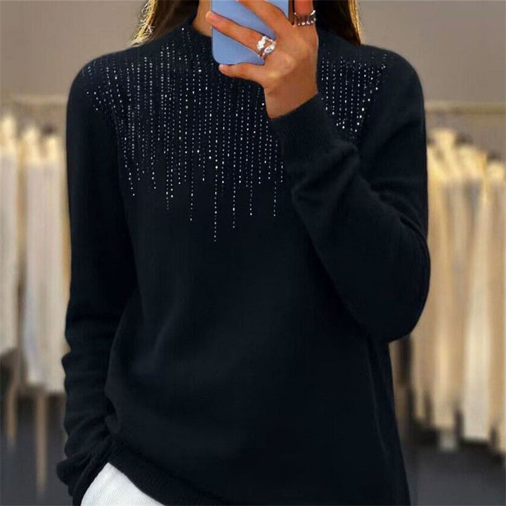 Women's cozy fine knit sweater with subtle rhinestone embellishment at the round neckline and ribbed hem Mune Fashion