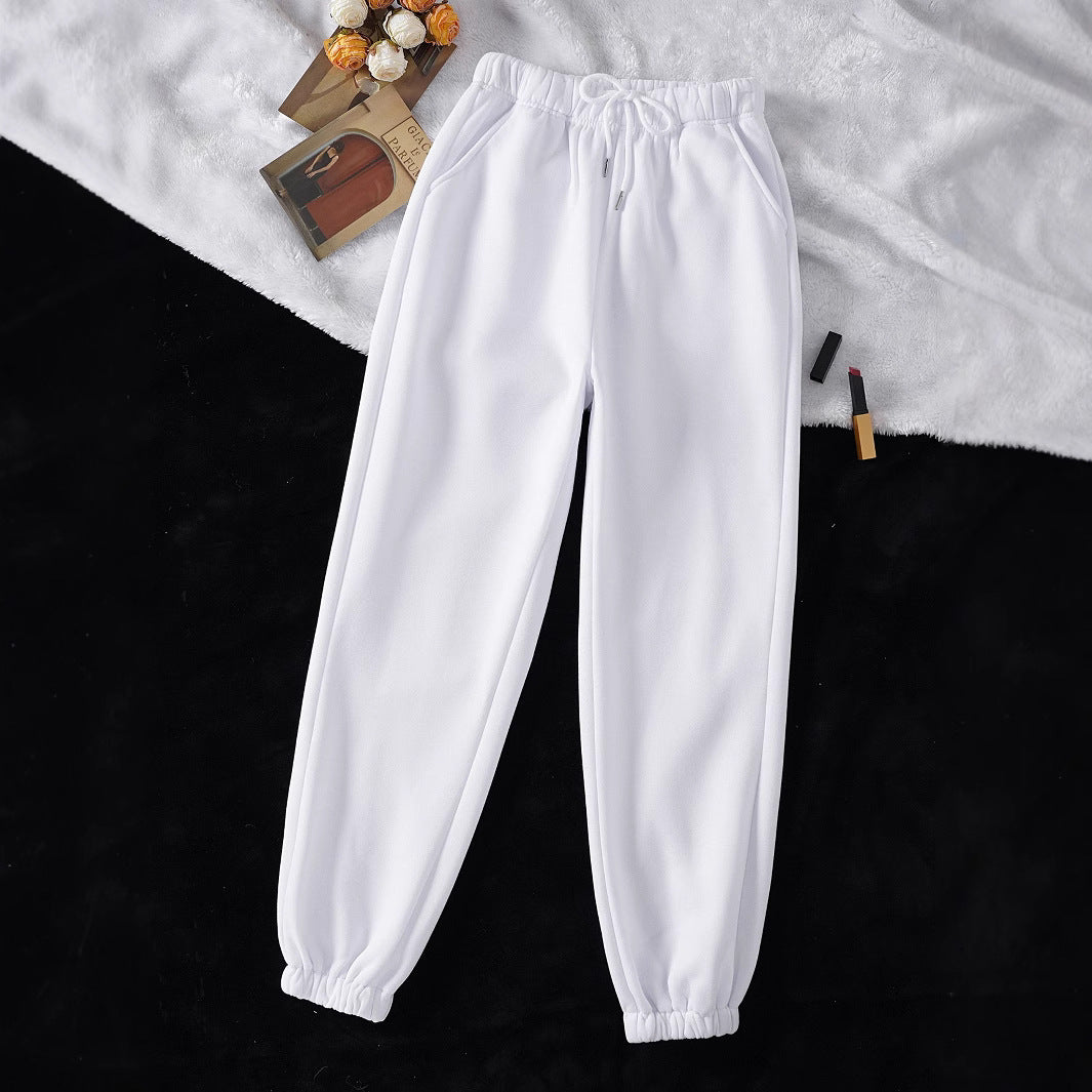 Women's high-cut joggers made of soft fleece cotton blend with elastic waistband, drawstring, and side pockets Mune Fashion