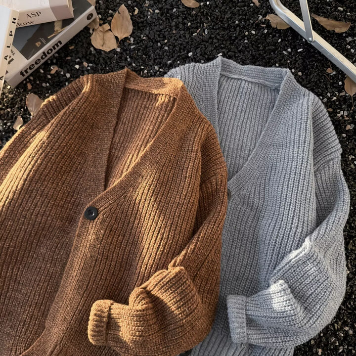 Unisex chunky knit cardigan in oversized cut with deep V-neck and distinctive button placket Mune Fashion