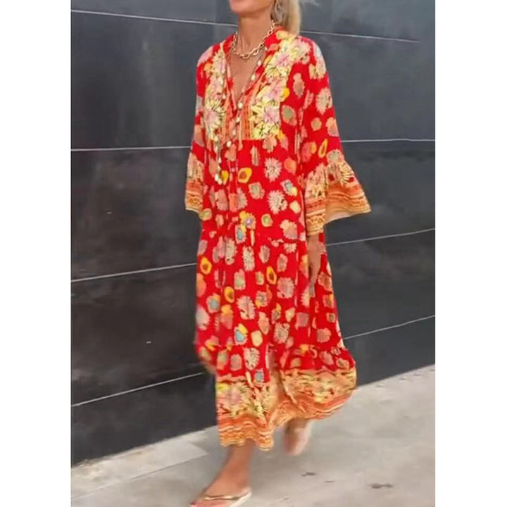 Women's airy kaftan midi dress with folk-inspired border print, V-neckline, tassel ties, and flounce bell sleeves Mune Fashion