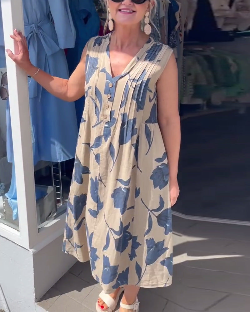 Women's sleeveless A-line midi dress with V-neck, bust pleats, button placket, and large floral print Mune Fashion