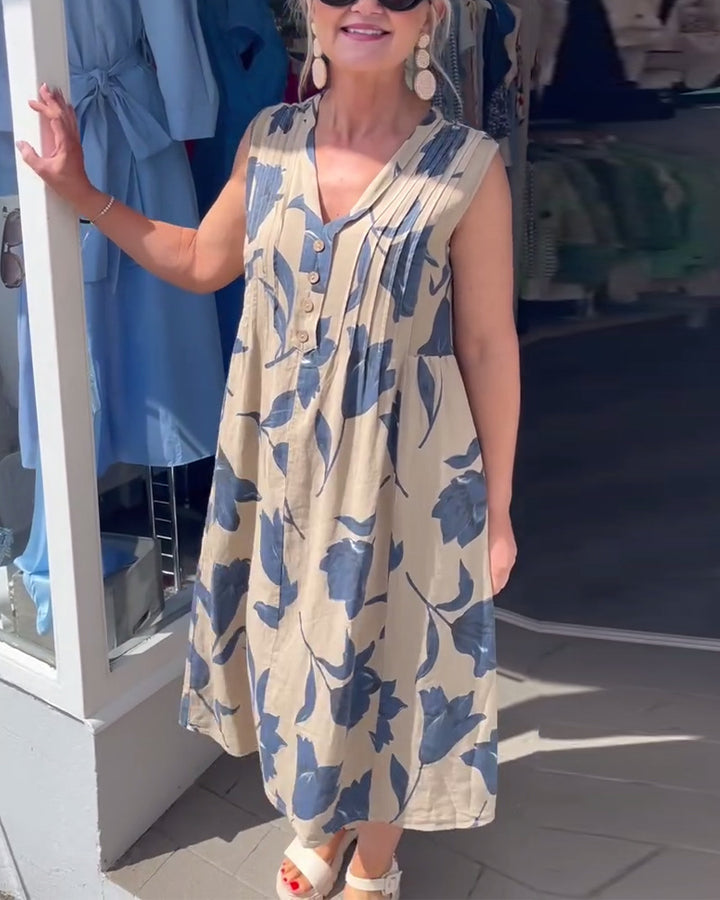 Women’s casual V-neck midi dress with bust yoke, vertical pleats, and decorative button placket Mune Fashion