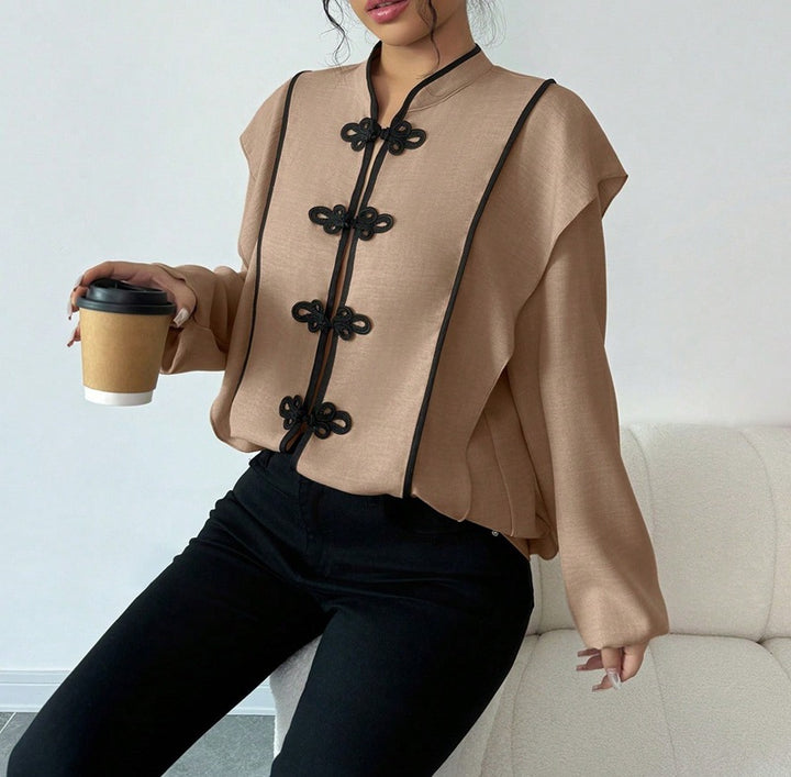 Women's stand-up collar blouse with decorative knot closures and decorative piping Mune Fashion