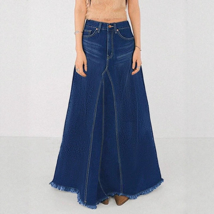 Women’s high-waisted A-line denim maxi skirt with decorative seams and raw fringe hem Mune Fashion