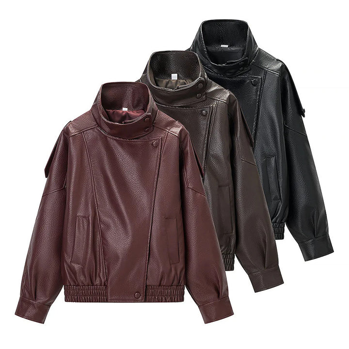 Women's oversized faux leather jacket with high stand-up collar, asymmetric snap button placket, and elastic hem Mune Fashion