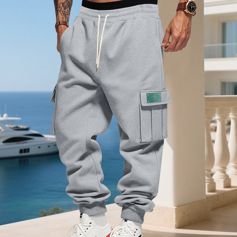 Men's cargo jogging pants with generous flap pockets, elastic waistband, and ribbed cuffs
