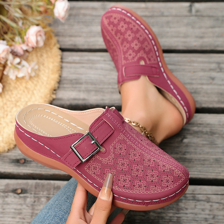 Women's comfort mule with adjustable buckled strap and ornamental hole embossing Mune Fashion
