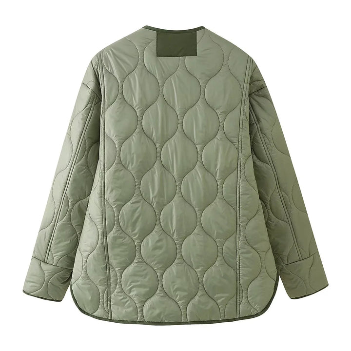 Women's light quilted transitional jacket with organic wave quilting, round neck, dropped shoulders, and flap pockets Mune Fashion