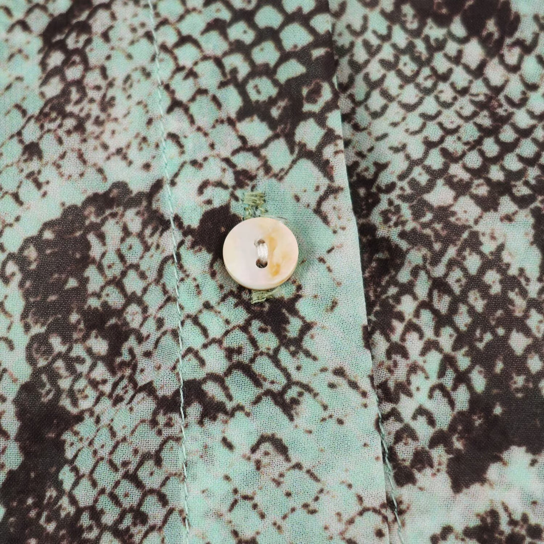 Women's blouse with waterfall shawl collar and snake print Mune Fashion