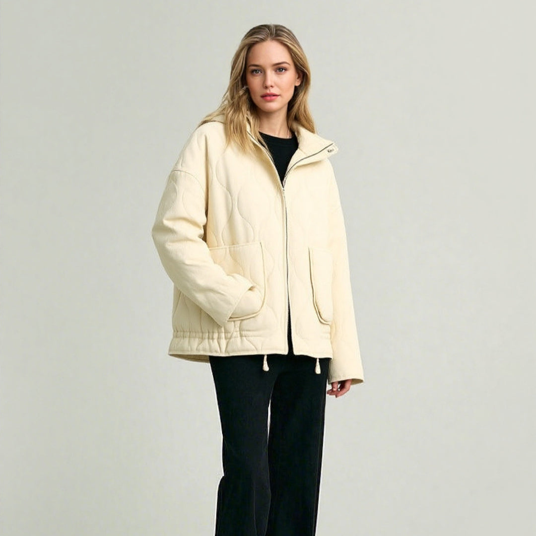 Unisex quilted jacket with stand-up collar, front pockets, and drawstring Mune Fashion