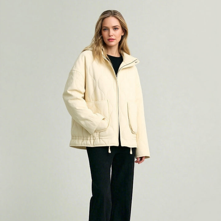 Unisex quilted jacket with stand-up collar, front pockets, and drawstring Mune Fashion