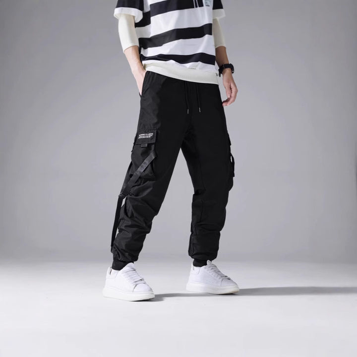 Men's tapered utility cargo pants in jogger style with multiple pockets, drawstring & elastic ankle cuffs Mune Fashion