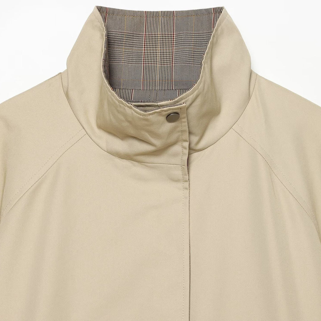 Women's reversible lightweight transitional jacket with stand-up collar, raglan sleeves, and drawstring hem Mune Fashion