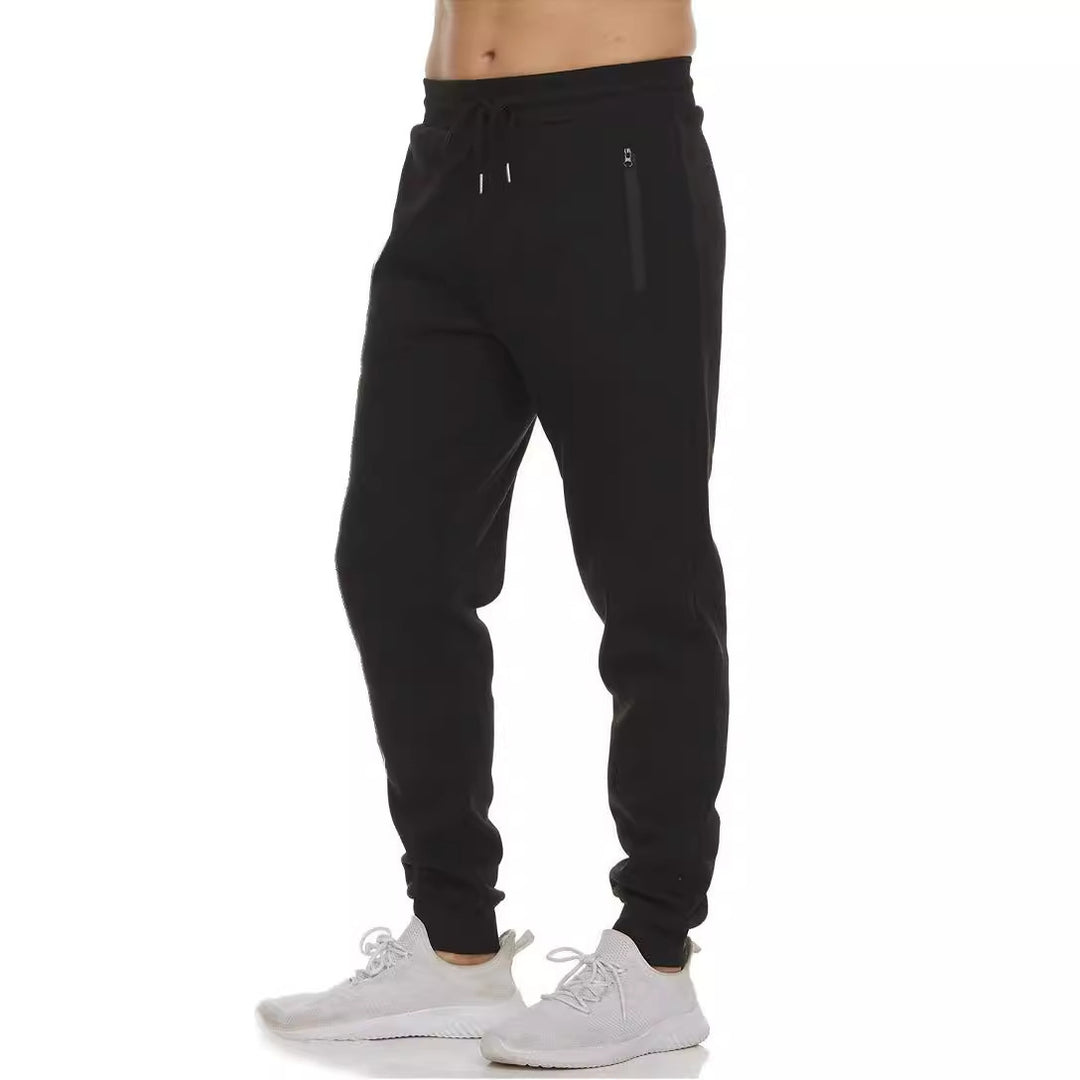 Women's nan tapered jogging pants with elastic comfort waistband, water-repellent zip pocket and ribbed ankle cuffs Mune Fashion