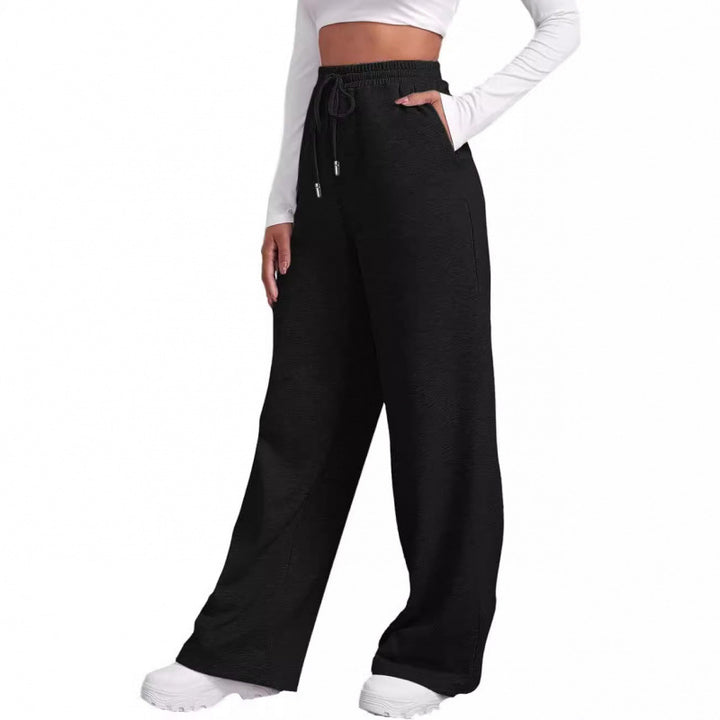 Women's flowing high-waist palazzo lounge pants made of lightweight jersey with elastic waistband and practical side pockets Mune Fashion