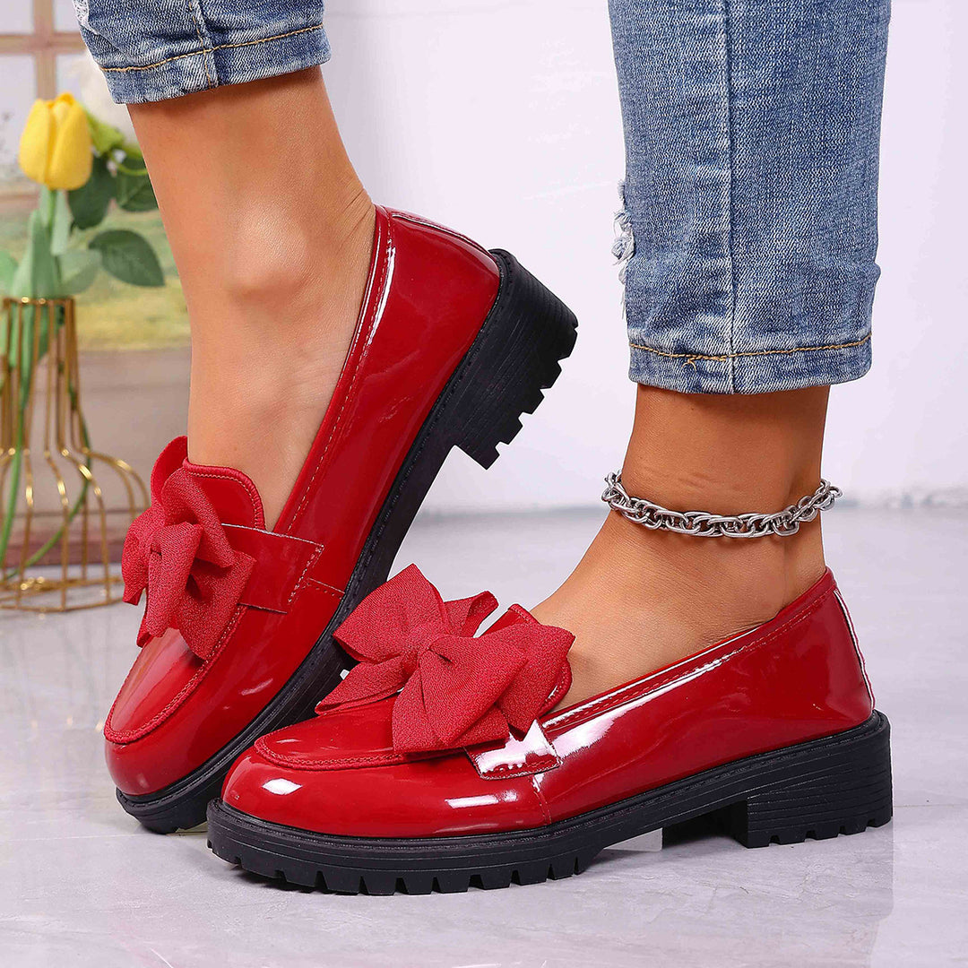 Women's patent leather platform loafers with patterned rubber sole and decorative bow Mune Fashion