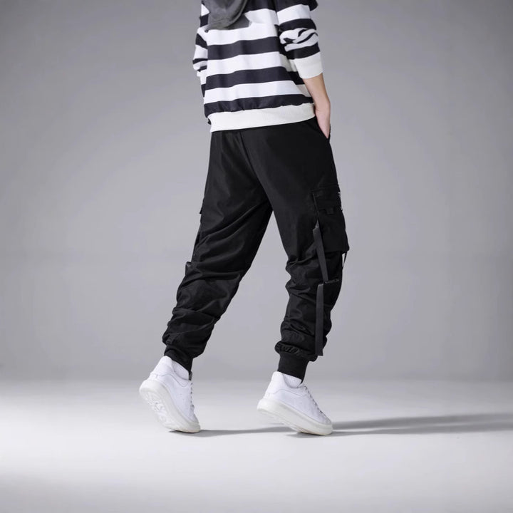 Men's tapered utility cargo pants in jogger style with multiple pockets, drawstring & elastic ankle cuffs Mune Fashion