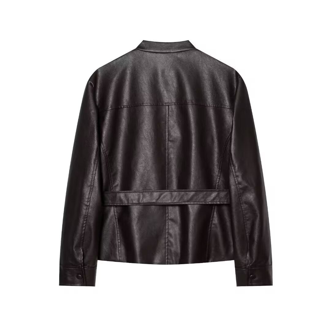 Women's short jacket made of faux leather with a belted waist, flap pockets, and stand-up collar Drune