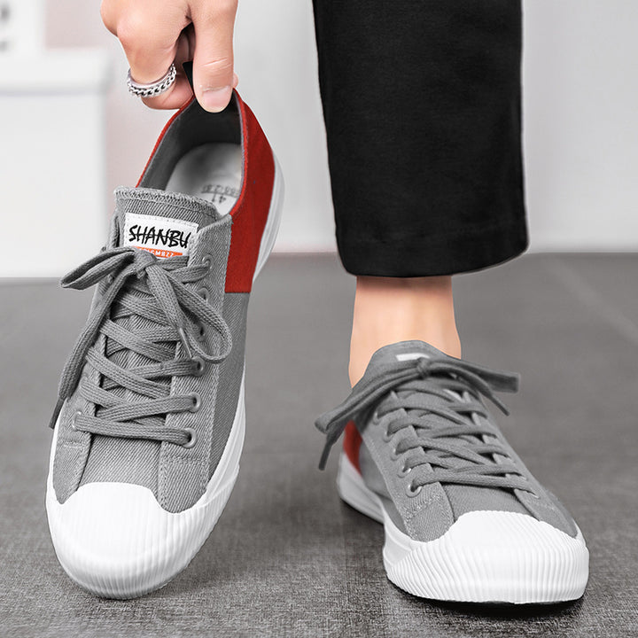 Unisex low canvas sneakers with reinforced rubber toe cap and contrasting textile panels Mune Fashion