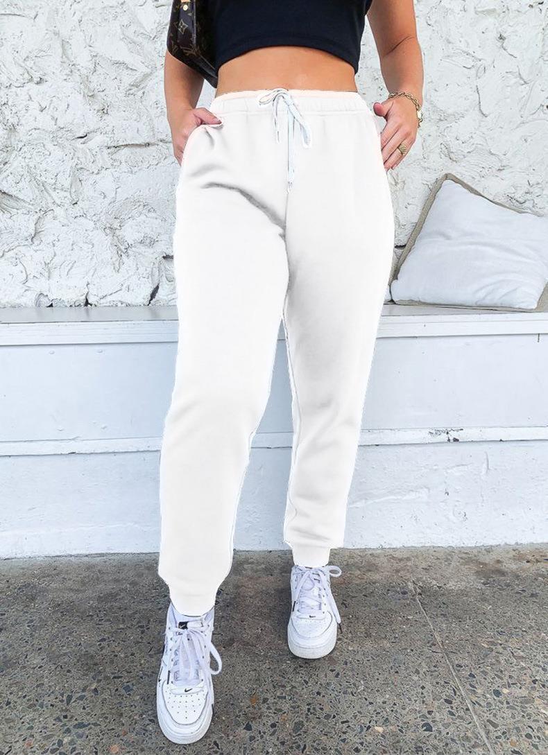 Women's tapered jogging pants at ankle height with elastic comfort waistband, adjustable drawstring, and deep side pockets Mune Fashion
