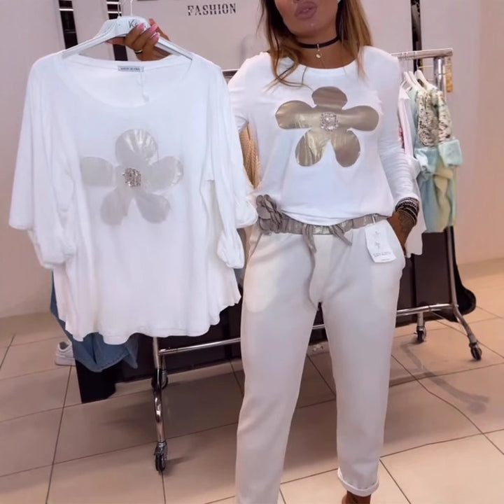 Women's locker-cut longsleeve with metallic flower appliqué and decorative centerpiece Mune Fashion