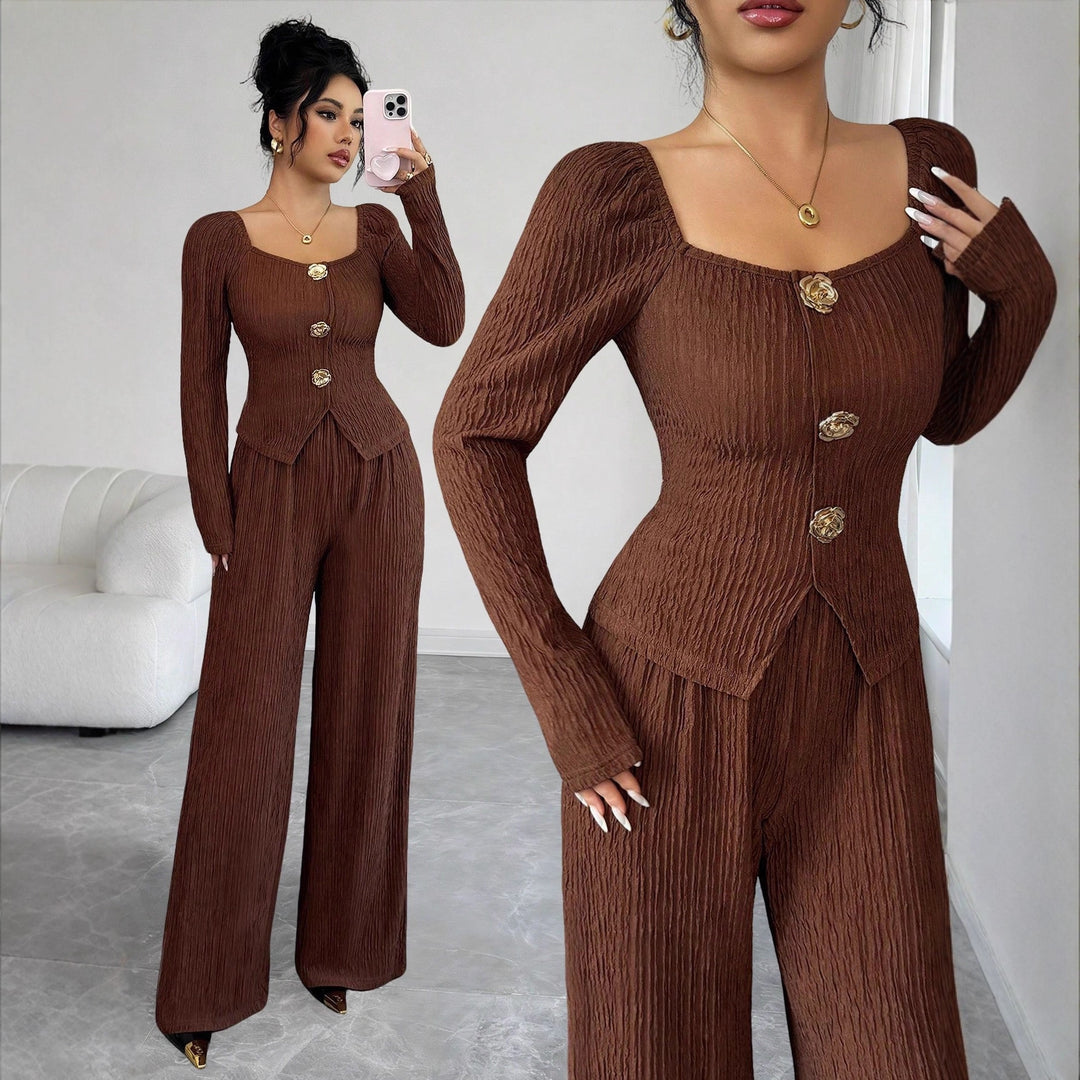 Women's tailored blouse and pants set made of crinkle pleats with puff sleeves and decorative buttons Mune Fashion