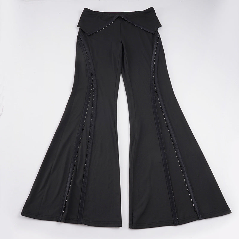 Women’s flared trousers with V waistband, side insert panels and decorative rivets Mune Fashion