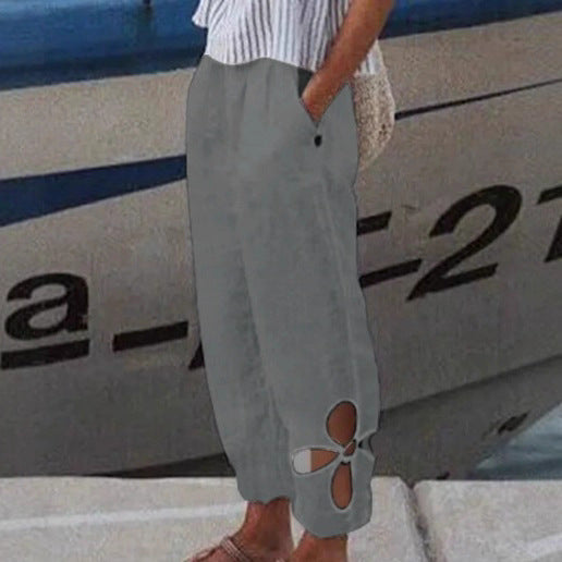 Women's ankle-length culotte pants with elastic waistband, side pockets, and floral hem cutout Mune Fashion