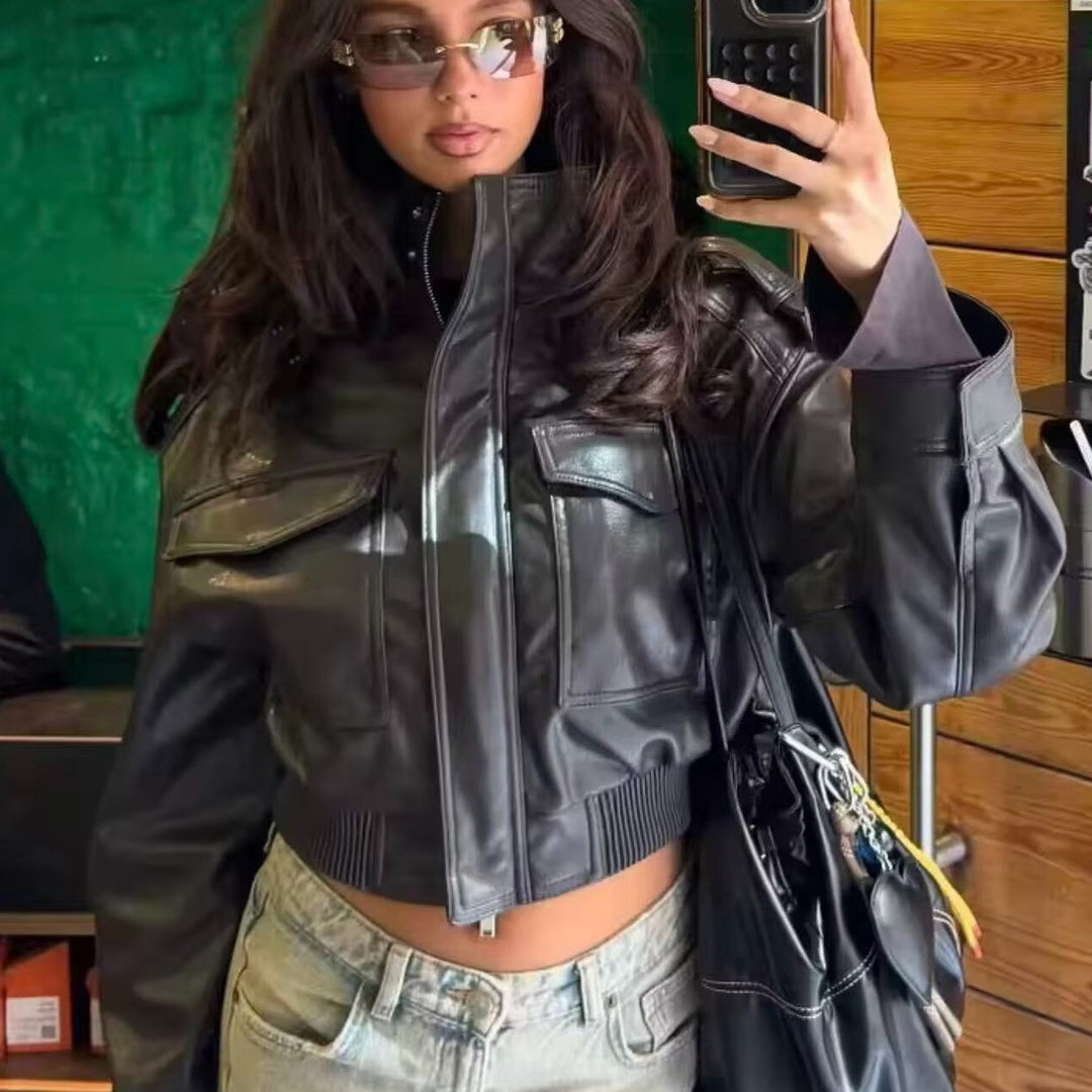 Women Short-Cut Leather Bomber with High Stand Collar, Shoulder Straps and Flap Pockets Mune Fashion