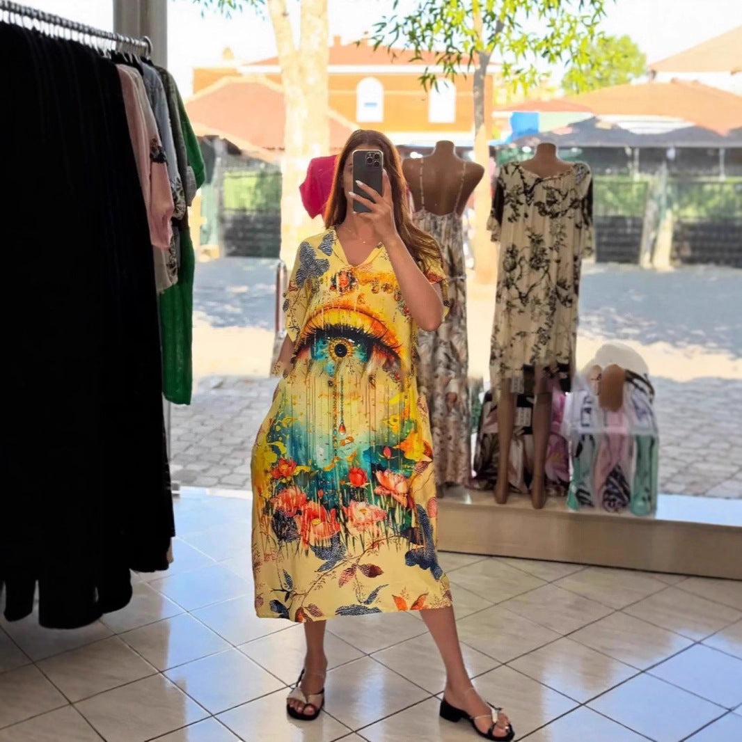 Women flowing maxi kaftan dress with V-neck and large watercolor floral print Mune Fashion