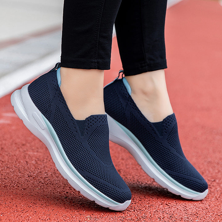 Women's slip-on knit trainer with sock-like shaft, pull tab, and responsive cushioning Mune Fashion