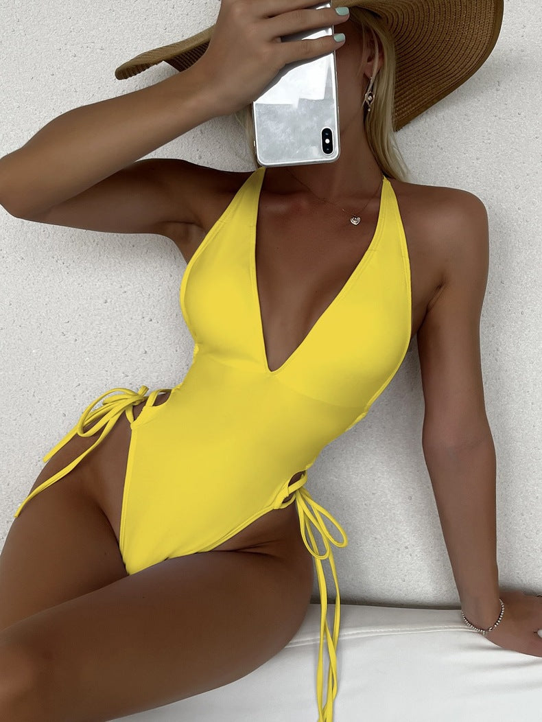 Women’s one-piece swimsuit with a deep V-neckline and side lace-up details Mune Fashion