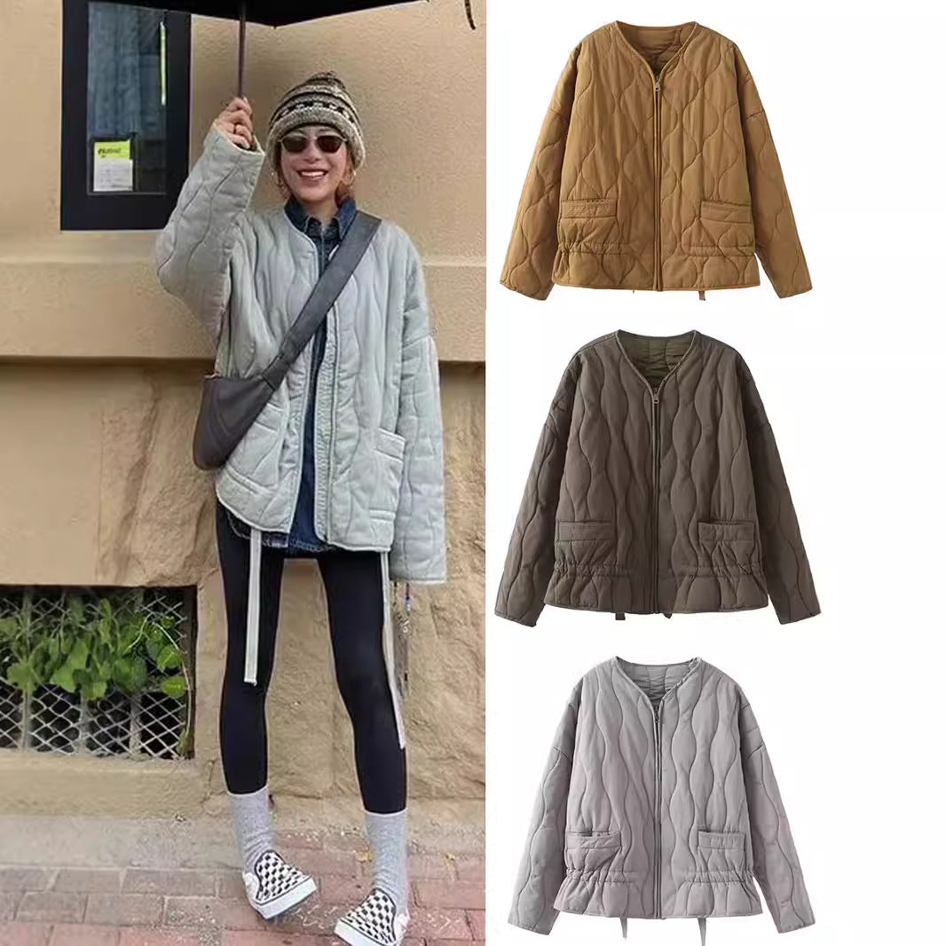 Ladies' nan quilted lightweight transitional jacket with wave quilting, patch flap pockets, and drawstring hem Mune Fashion