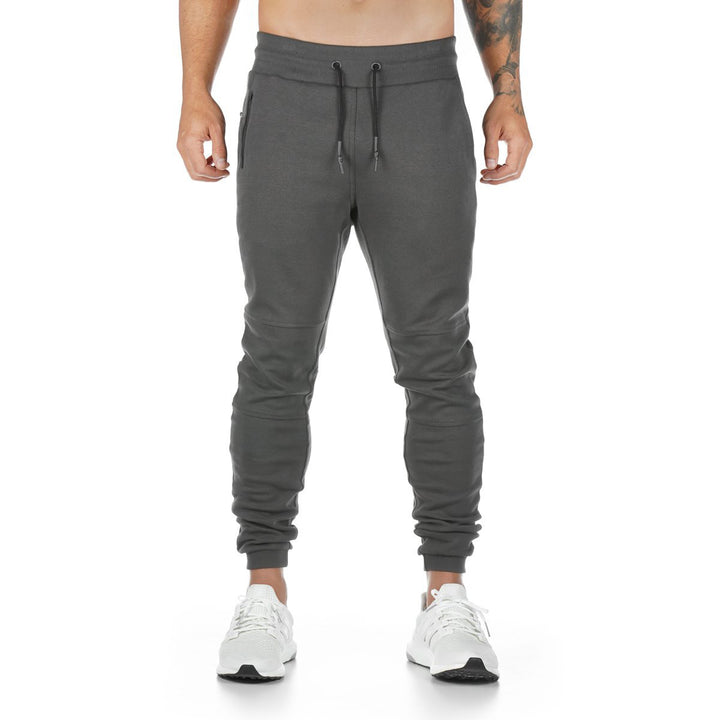 Men's narrow-cut joggers with ribbed waistband, zip pocket, and knee darts Mune Fashion