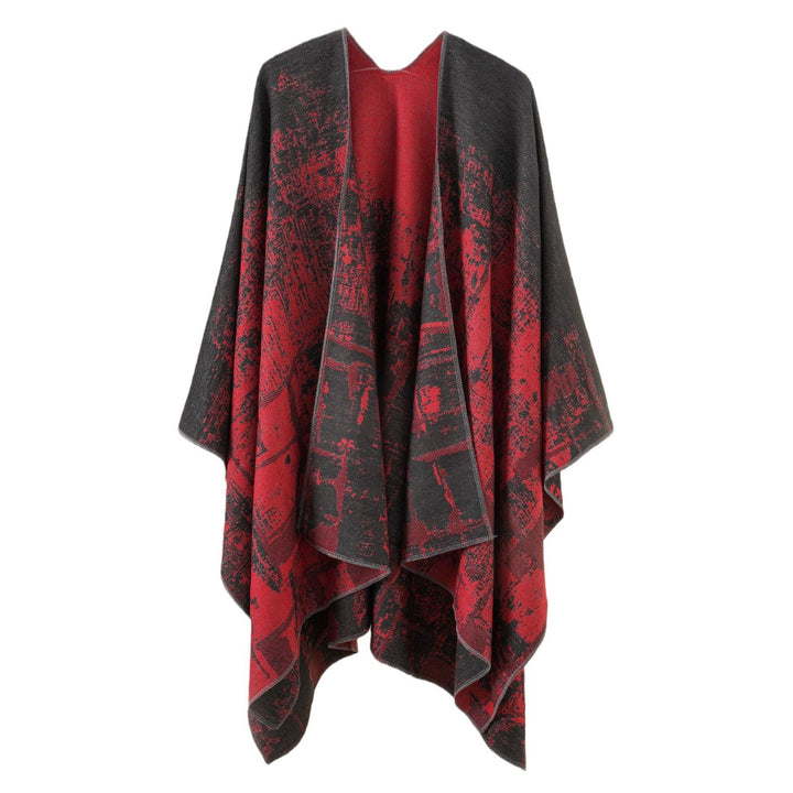 Women's wool blend cape with graphic jacquard, open kimono fall, and soft draping.
