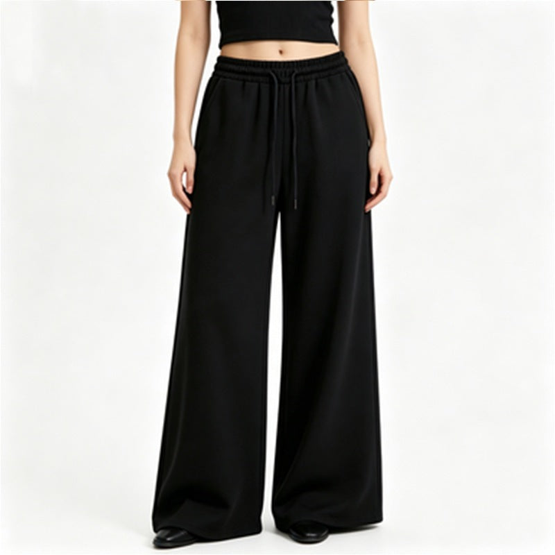 Ladies wide high-waist lounge pants with elastic waistband, drawstring, and flowing jersey Mune Fashion