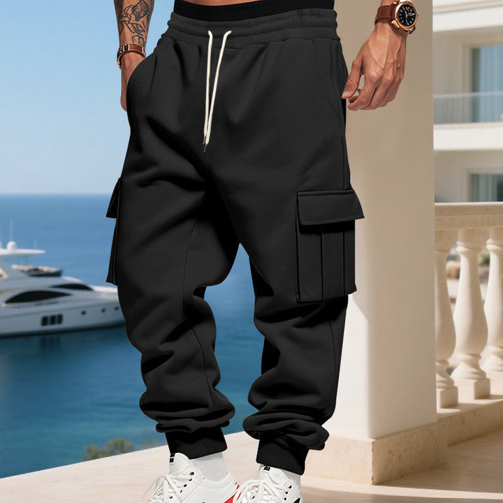 Men's cargo jogging pants with generous flap pockets, elastic waistband, and ribbed cuffs