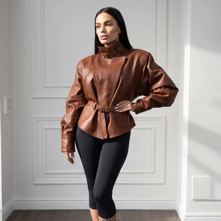 Women's tailored faux leather jacket with standing collar, neck strap, and figure-shaping waist belt Mune Fashion