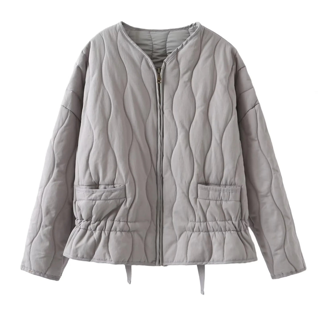 Ladies' nan quilted lightweight transitional jacket with wave quilting, patch flap pockets, and drawstring hem Mune Fashion