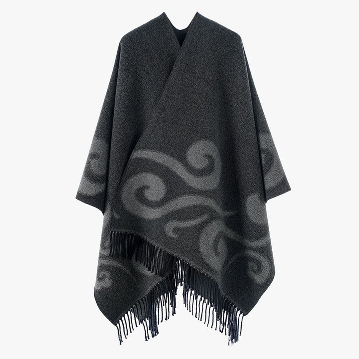 Women's wool blend poncho with jacquard swirl pattern, V-neck and fringes