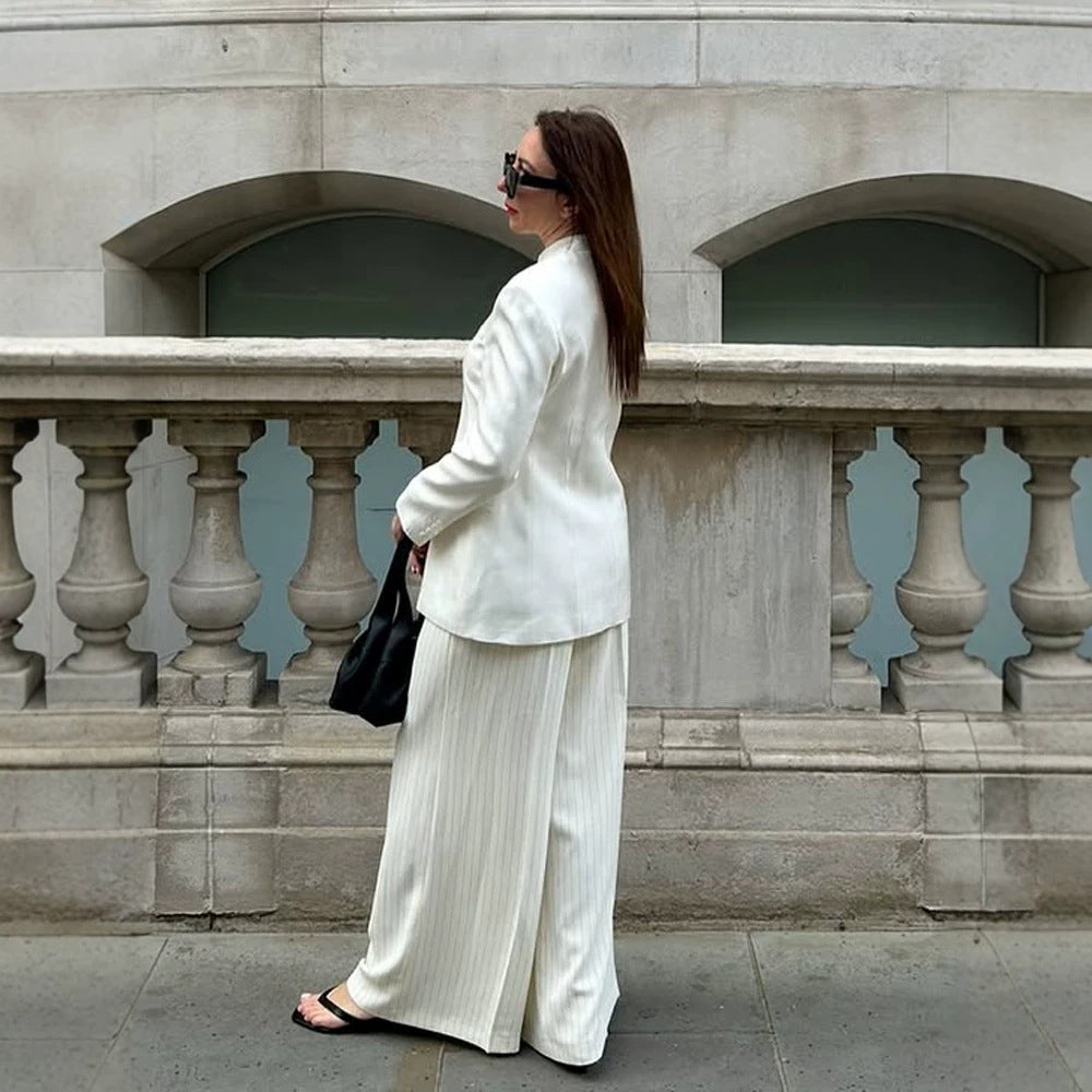 Women's tailored long blazer with a stand collar, boxy shoulder, and concealed button placket Mune Fashion