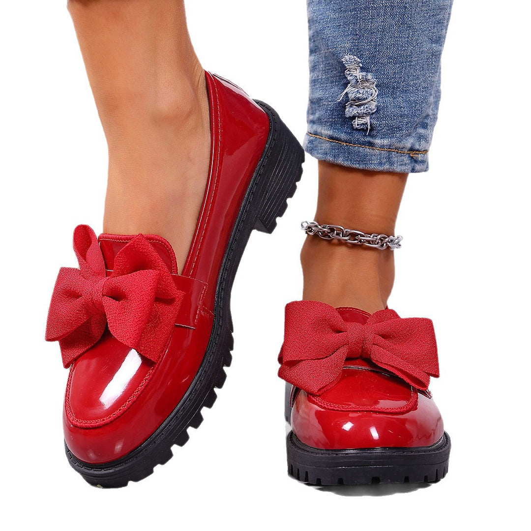 Women's patent leather platform loafers with patterned rubber sole and decorative bow Mune Fashion