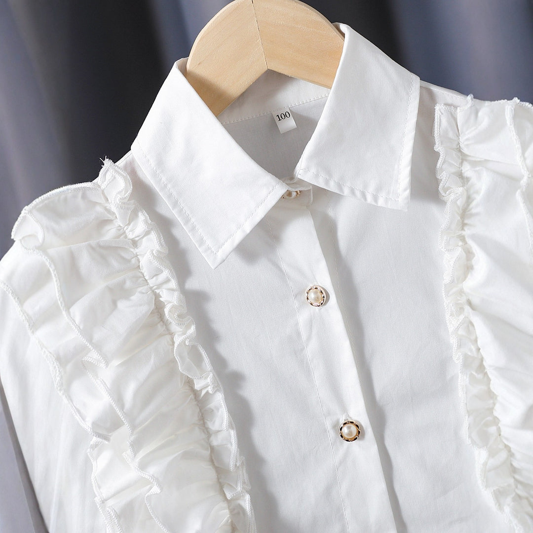 Girls blouse with ruffle details and elegant puff sleeves Mune Fashion